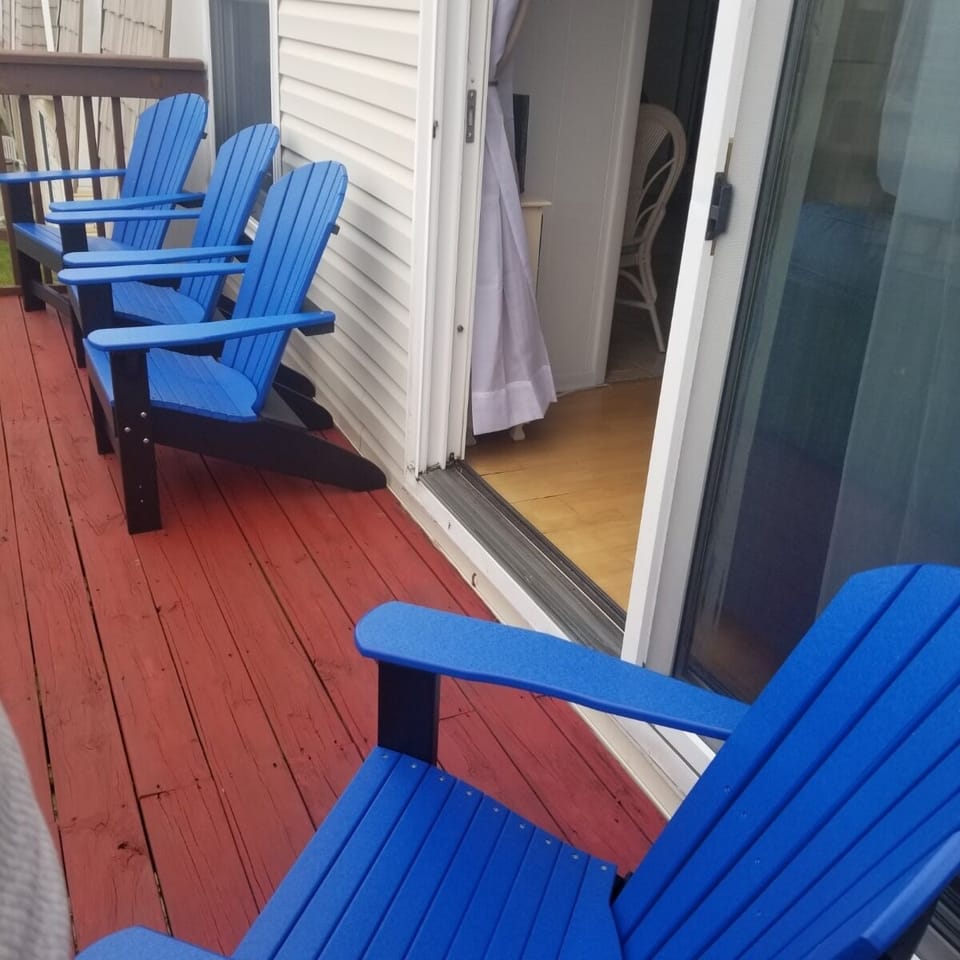 Relax on the balcony on Adirondack chairs