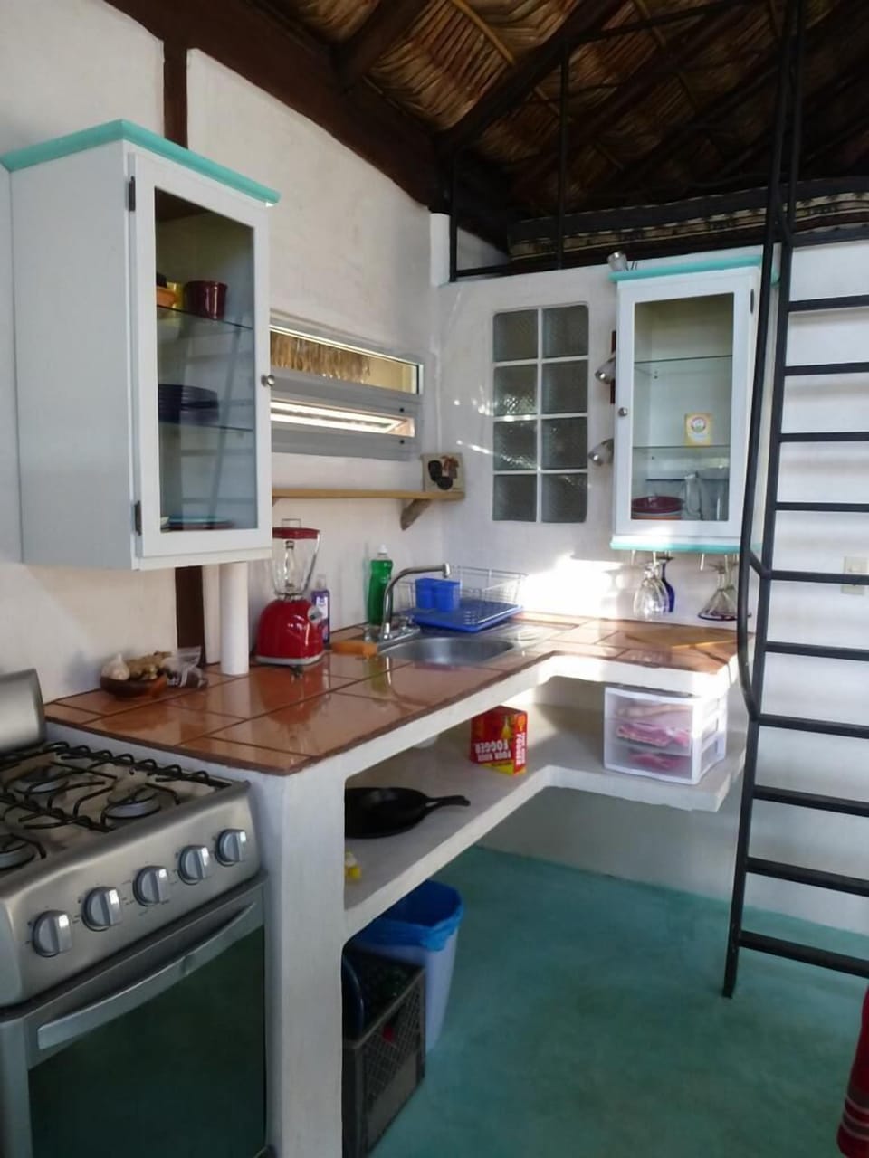 Kitchen with gas 4 burner stove and oven.