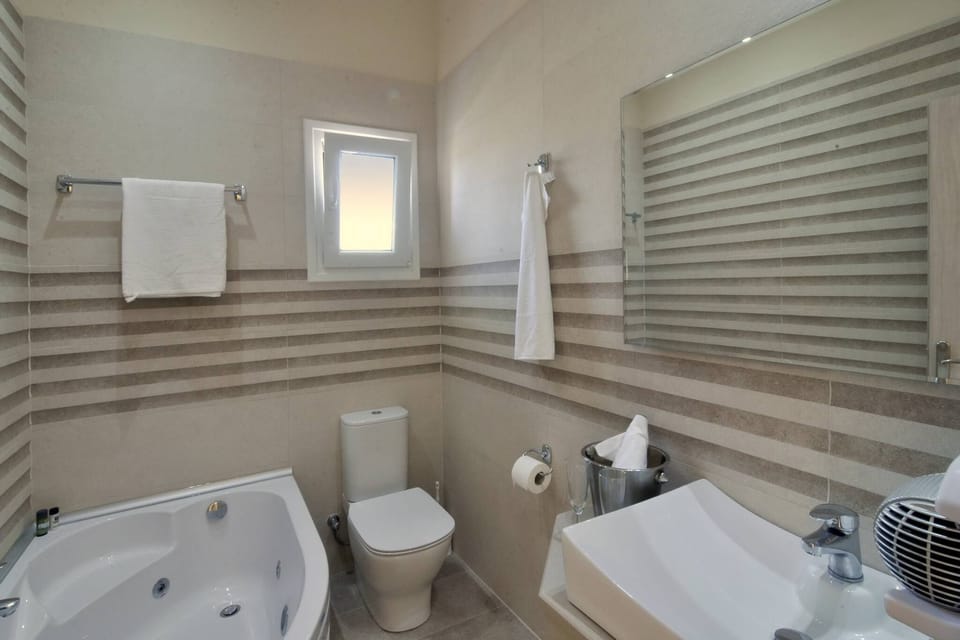 Katoi Apartment  1 in Agios  Georgios  Pagoi bath with jacuzzi