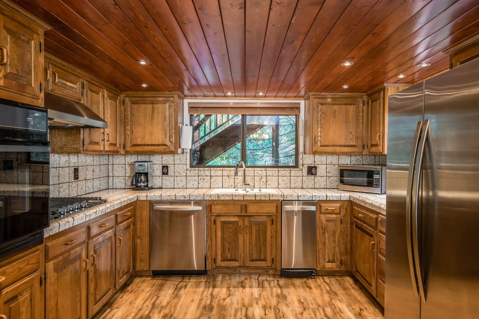 Stainless steel appliances and recessed lighting with a touch of vintage.