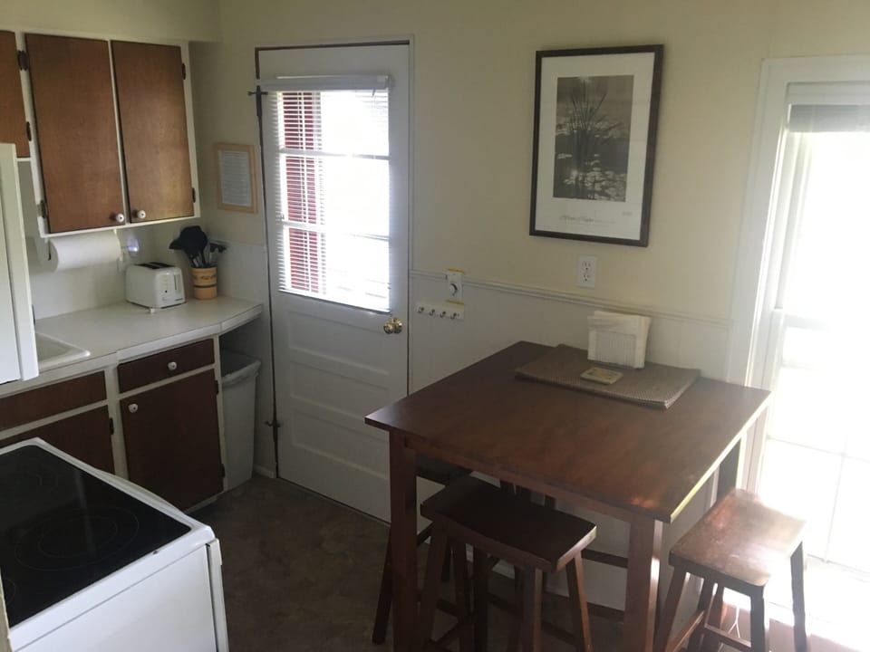 Rear/side entrance in kitchen leads to deck and exterior stairs
