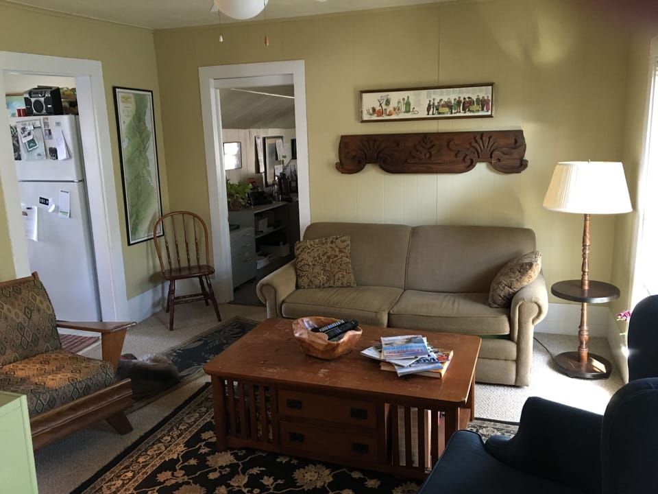 Living room off the north bedroom & full kitchen.