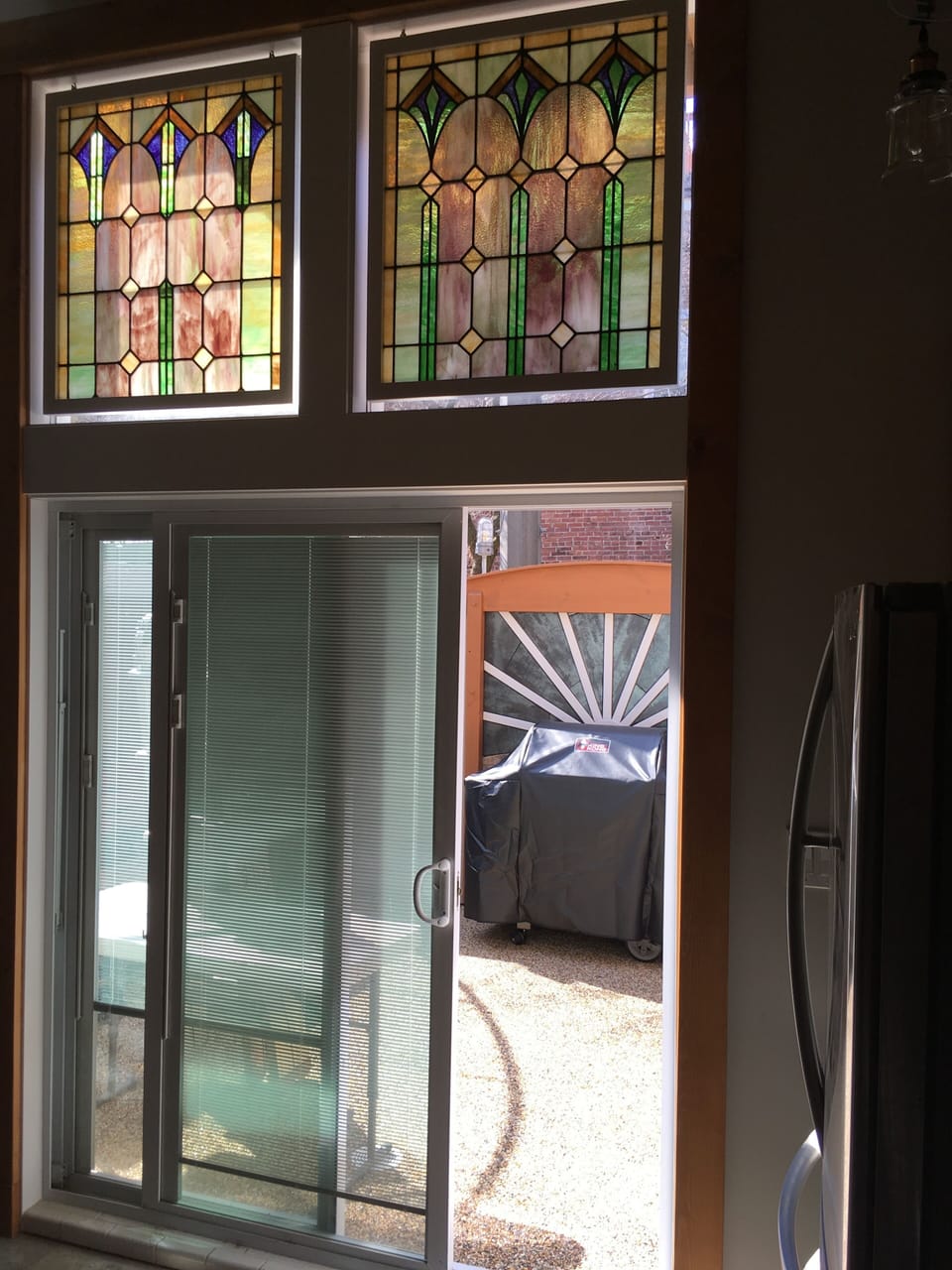 Entrance to patio below stained glass 