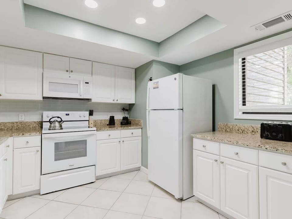 Cook with ease in a bright kitchen with ample counters.