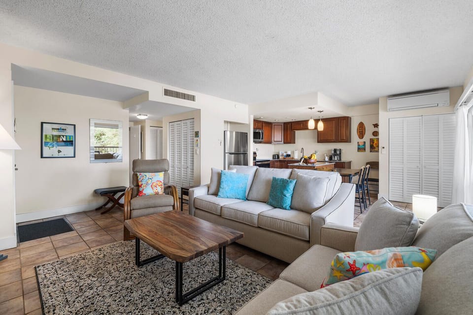 Open living space with Queen sleeper sofa tropical touches, and a fully equipped kitchen perfect for your stay.