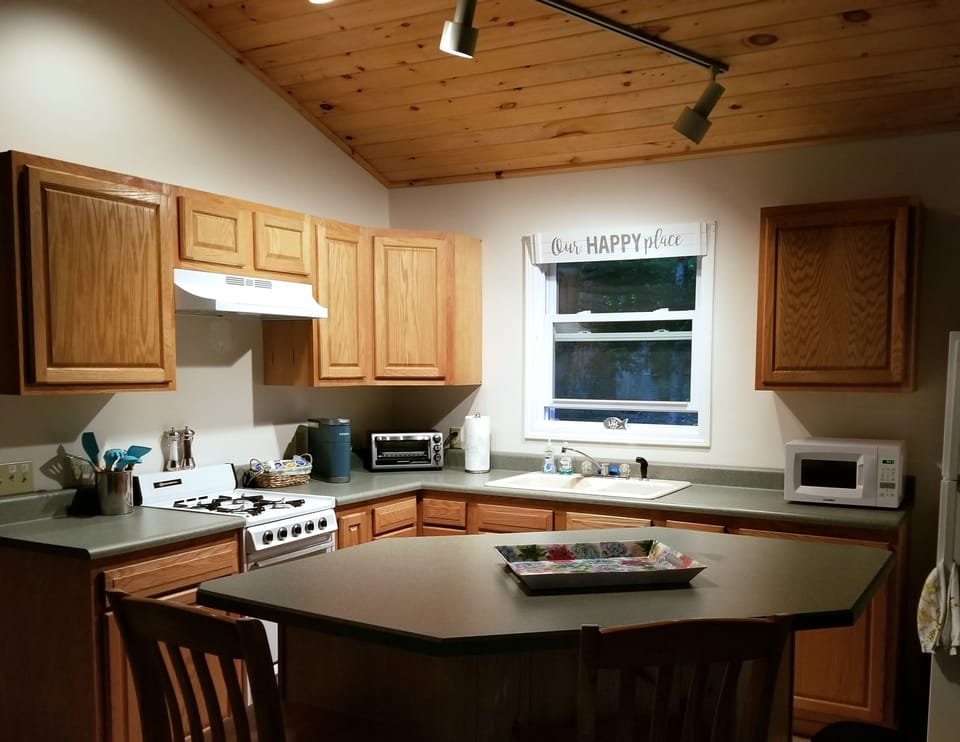 Well stocked kitchen including microwave, toaster oven, keurig coffee maker