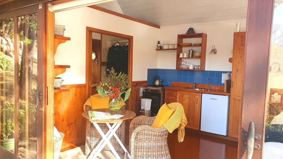 Cosy kitchen and dining are overlooking the water