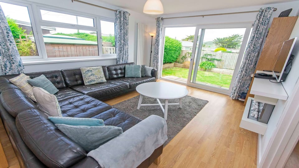 Lounge with patio doors leading to the garden