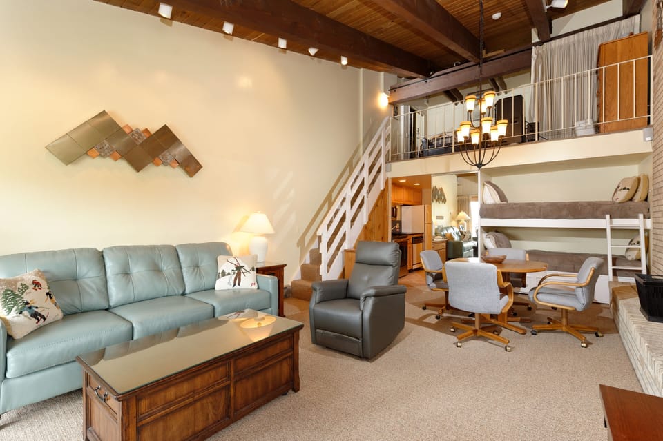 Bunk beds, dinning area, queen size sleeper sofa and stairs to loft.