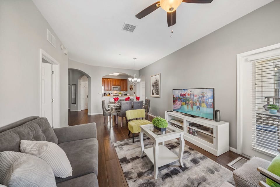 Open-concept flow: relax in the living room, dine at the table for six, and cook in the fully equipped kitchen-great for family time.
