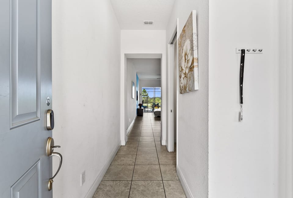 Step into the bright, airy entry hall with clean finishes and a welcoming view straight to the living area-simple, modern, and easy to relax in.