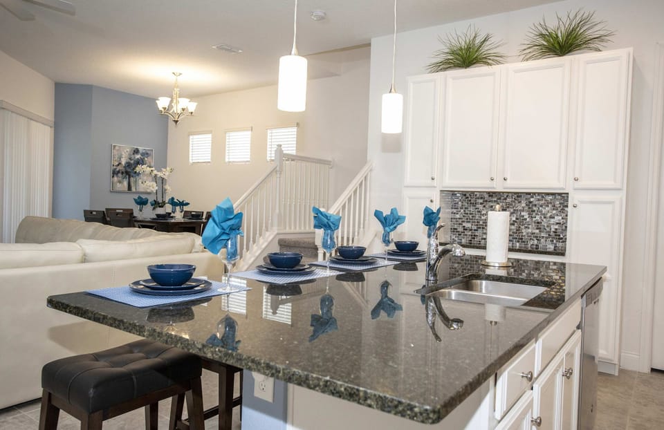 Elegant dining space designed for gatherings, featuring a stylish table set for your group.