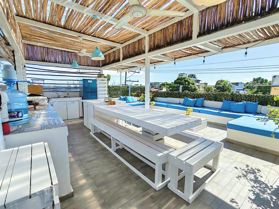 Open concept kitchen and dining area on rooftop terrace.