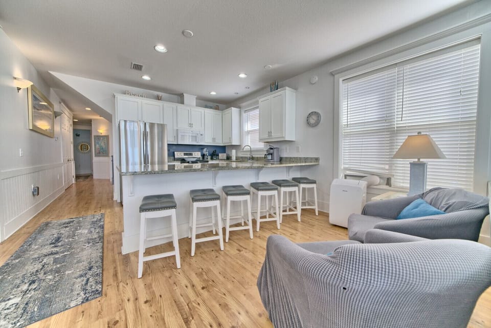 Cook, chat, and unwind in this open-concept kitchen with plenty of counter space. vbnet Copy code