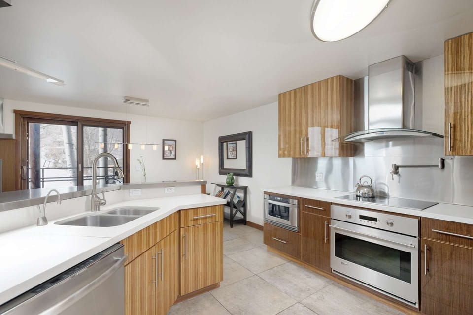 From the kitchen you can enjoy the incredible view of Aspen Mountain through the large windows and sliding glass doors.