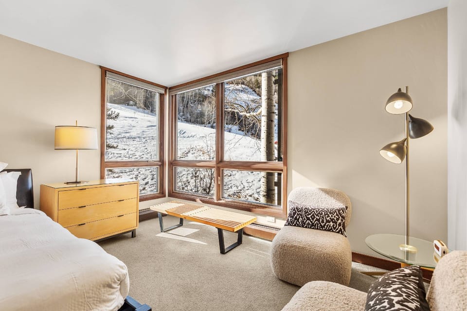 Relax in this cozy corner in the master bedroom with views of Aspen mountain