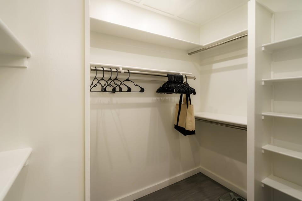 This spacious walk-in closet provides plenty of storage for your vacation essentials, ensuring a clutter-free stay in this luxury Maui rental.