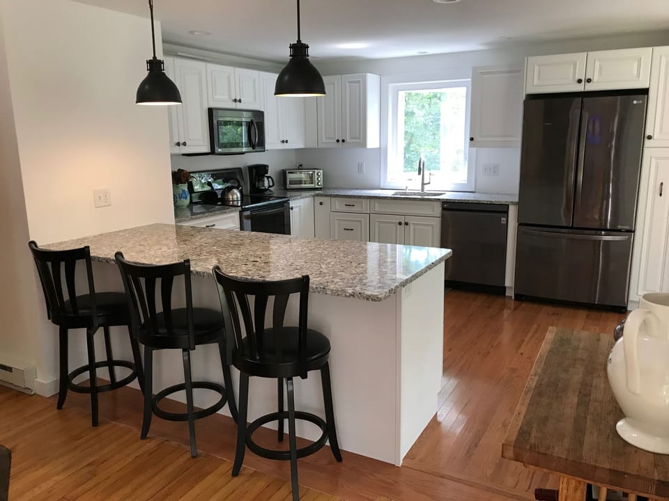 Newly renovated kitchen opens onto the living room. Air-conditioned area, too.