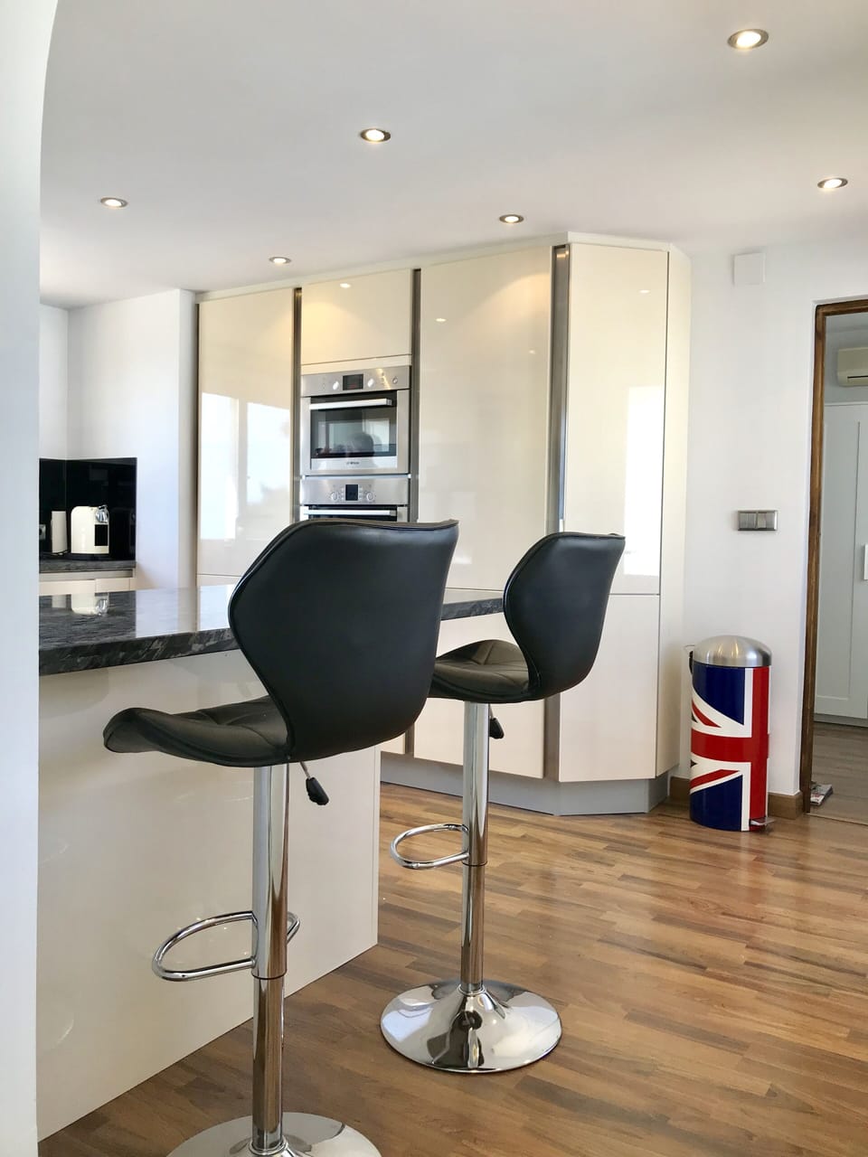 Fully fitted kitchen with breakfast bar.
