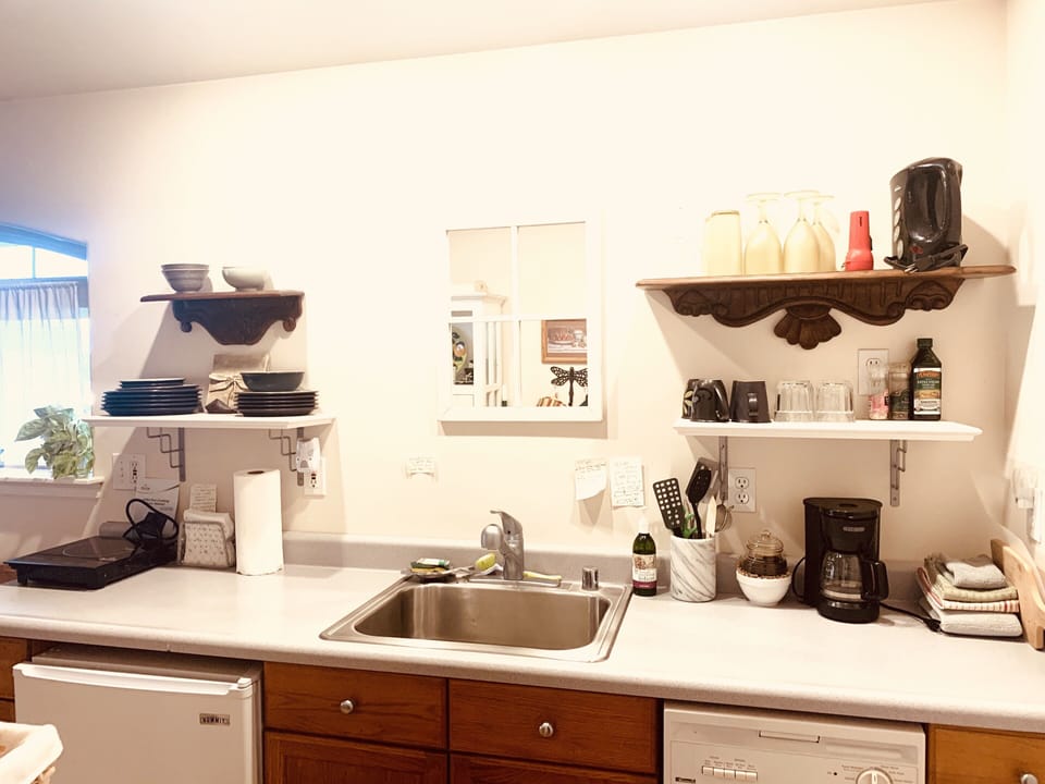 The Studio kitchen is well stocked  dishes+, pots, pans, stove, ovens and bbq