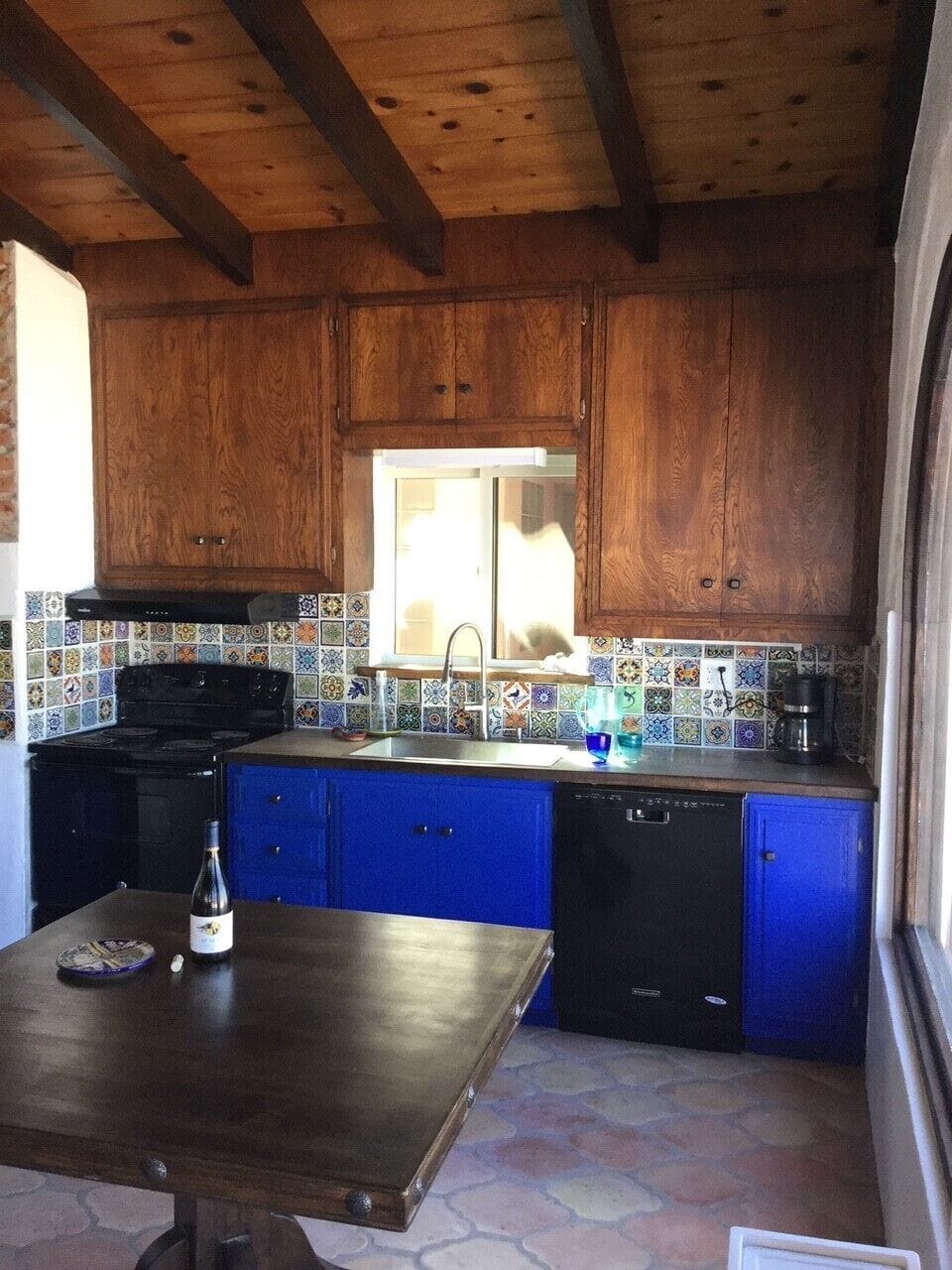 Kitchen/dining area with ocean view window 