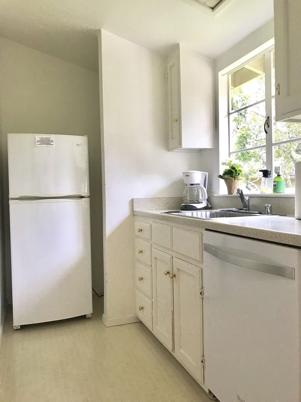 Refrigerator, dishwasher, coffee maker and stainless sink with garbage disposal 