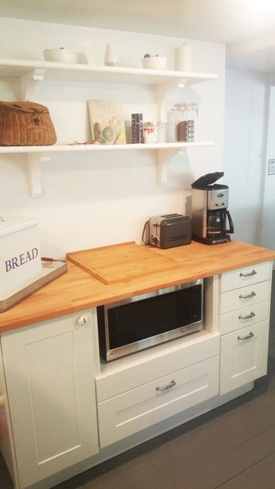 Microwave, coffee maker and toaster for your convenience.