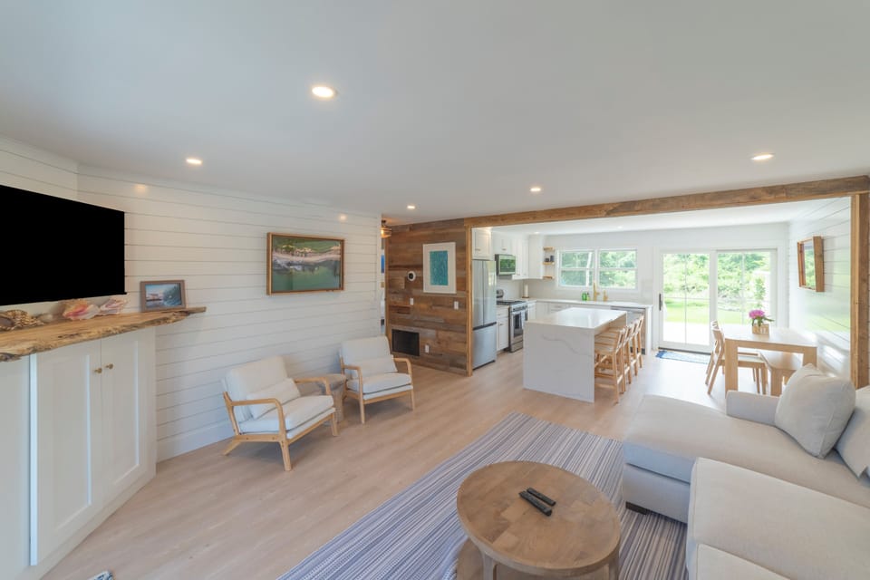 New Reno Open Concept Great room with large island, sectional, and dining area
