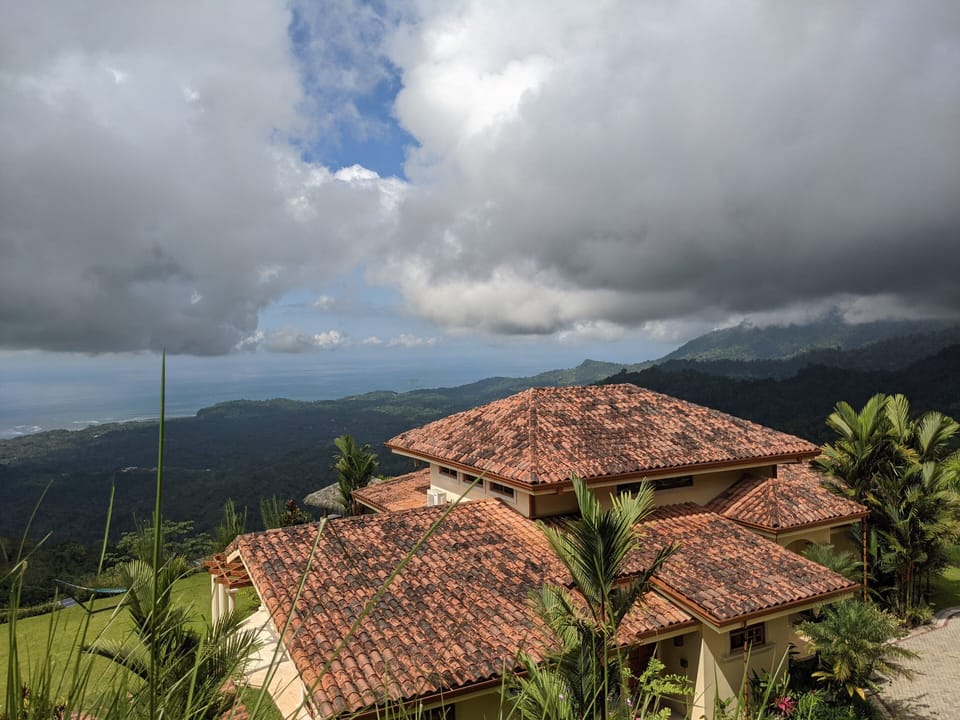 View of home from top of drive by gate