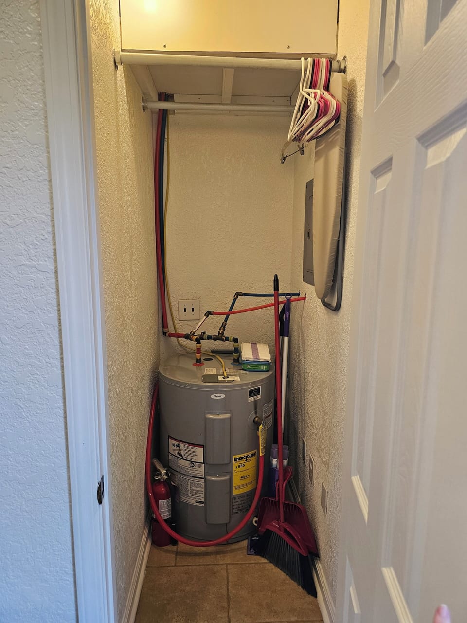 40 gallon hit water heater and closet.