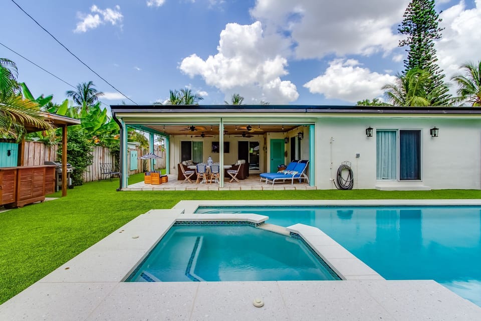 Lanai with motorized windows,heated pool and spa in tropical private backyard
