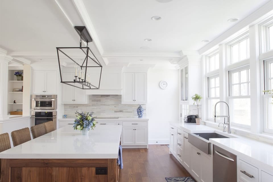 The kitchen island with four stools.