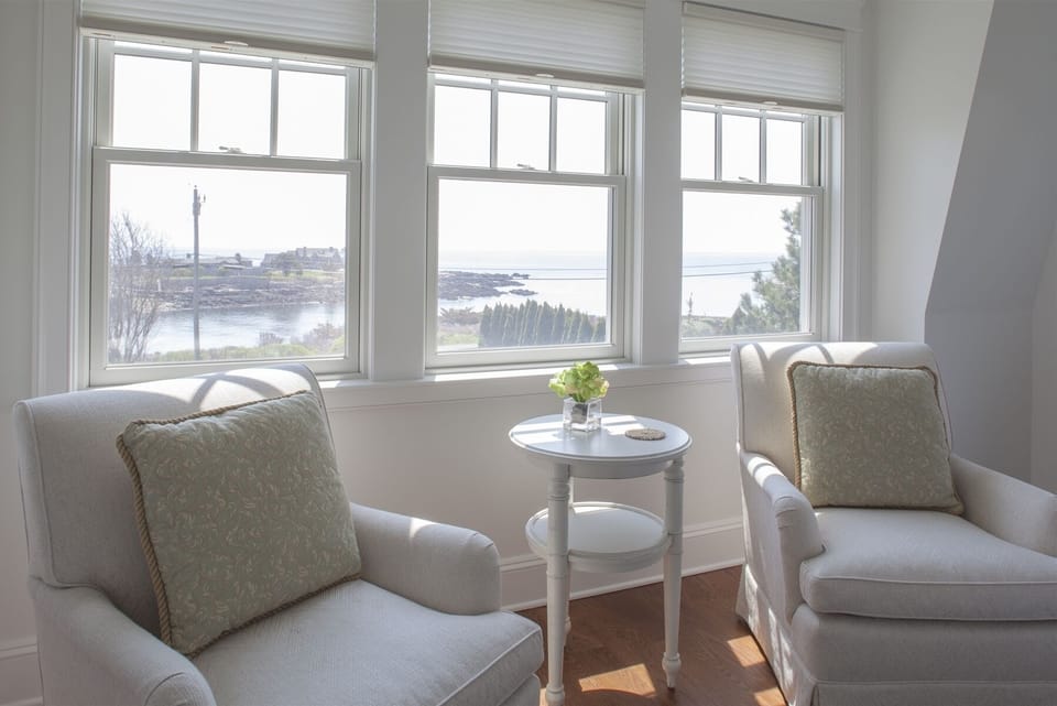 The sitting area in one of the bedrooms with a queen bed.