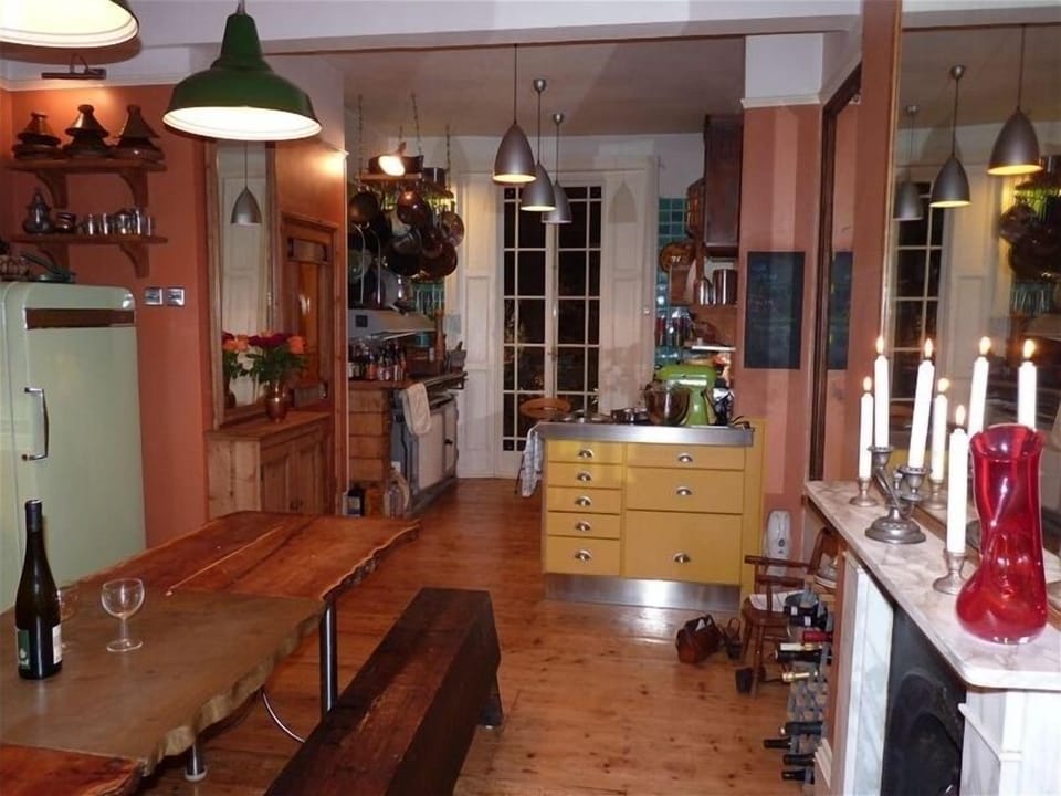 kitchen at night with french double doors to balcony