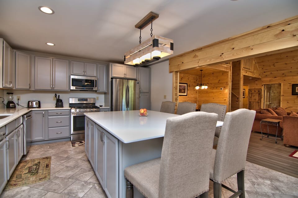 Modern Eat In Kitchen With Quartz Counter Top And Updated Cabinets. 