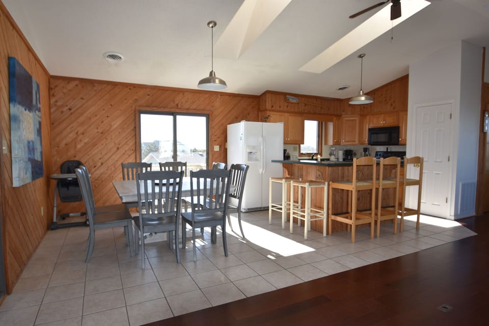 Before new floors and counter tops but shows open floor plan.  Seating for 13