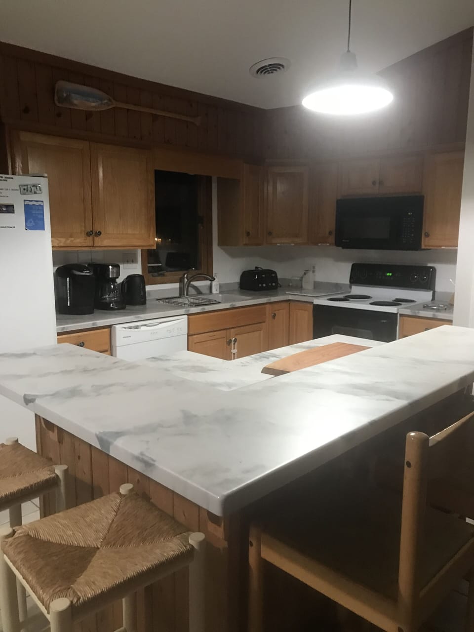 Seating for 5 around this island in open kitchen area.