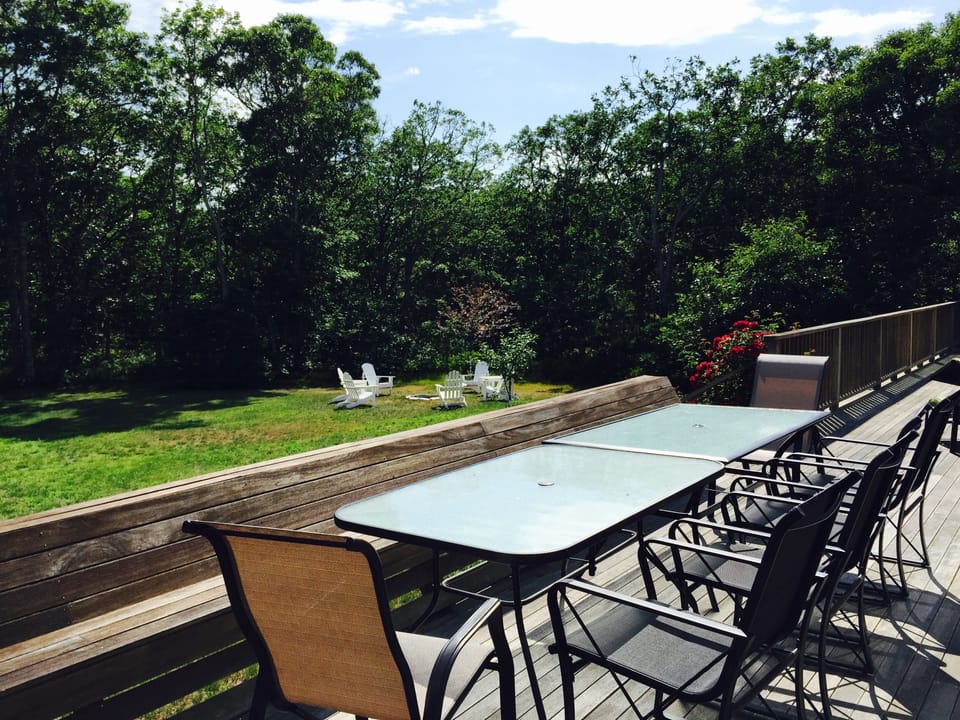 75' back deck w/BBQ and 2 outside showers.  Fire pit and chairs on lawn