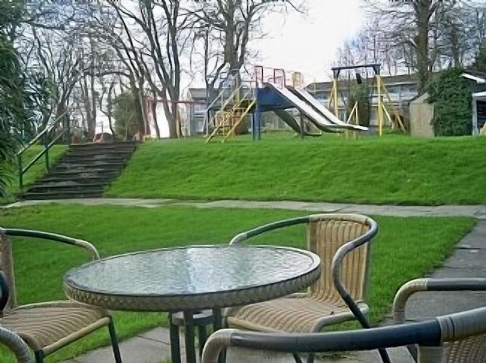 House patio area with play park.