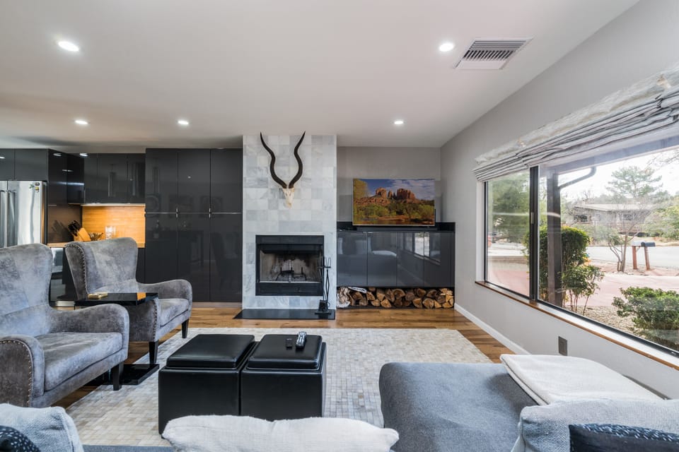 Spacious Living Room with a Big Picture Window for Lots of Natural Light. Fireplace is Not Operational