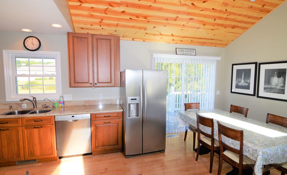 Large Eat In Kitchen / Dining Room With French Door To The Wraparound Porch