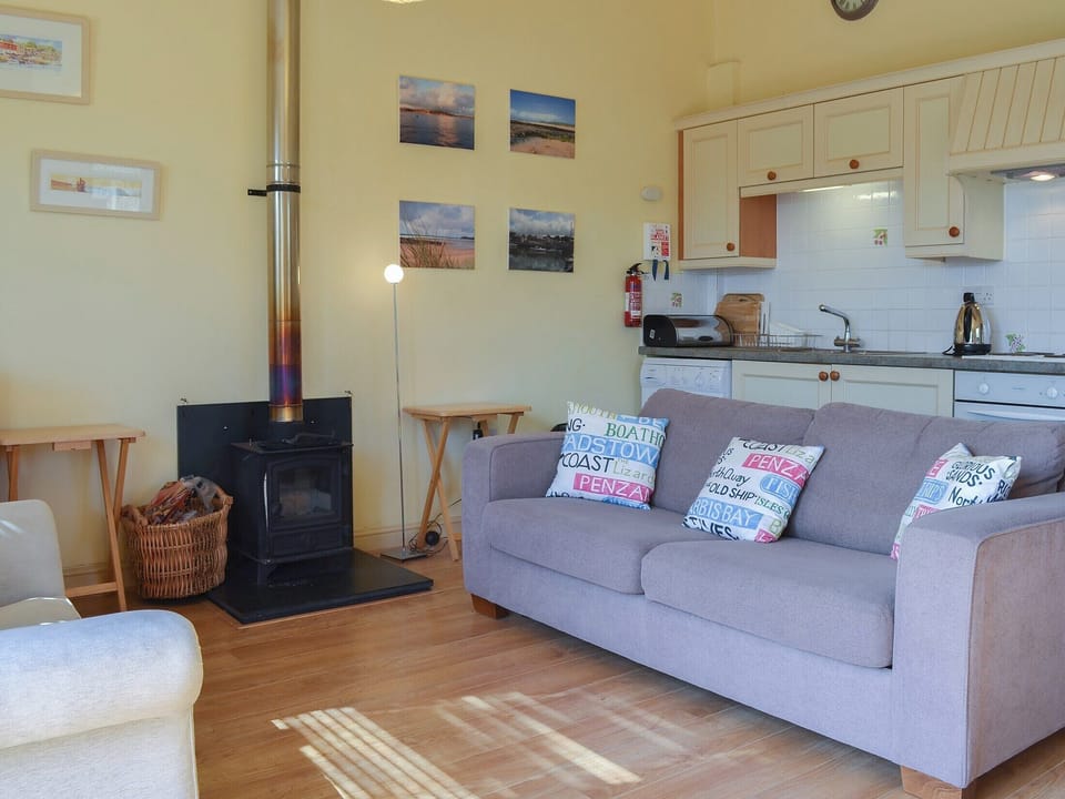 Charming wooden-floored living area | Tregella Farm Cottage, Near Padstow