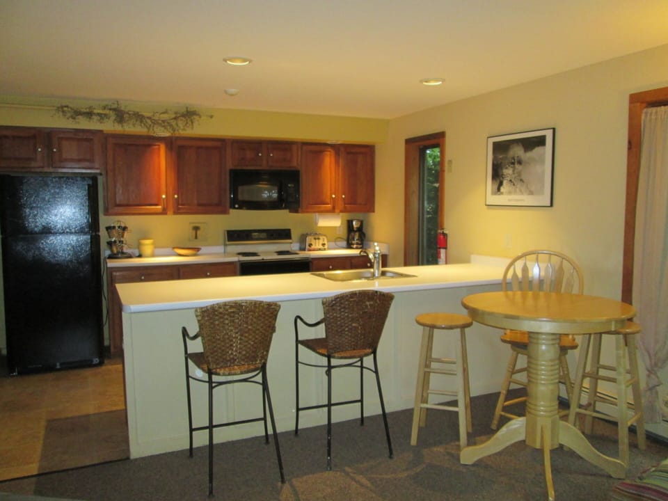 upper Level's full kitchen. Counter and table accommodate 5+ Hideaway Chalet