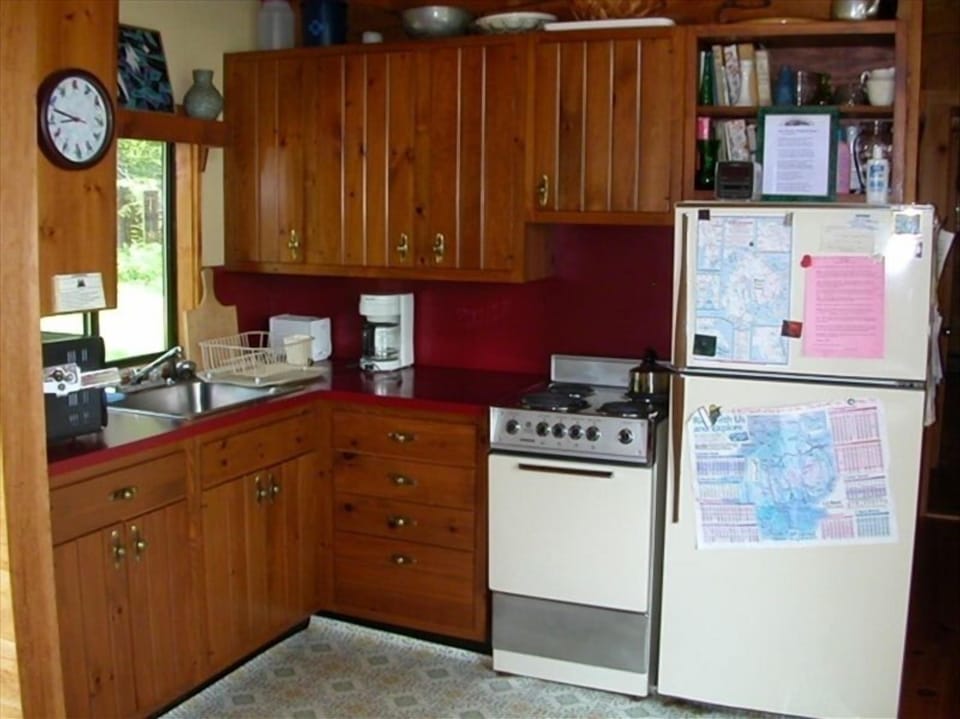 Kitchen area with oven, stove & microwave