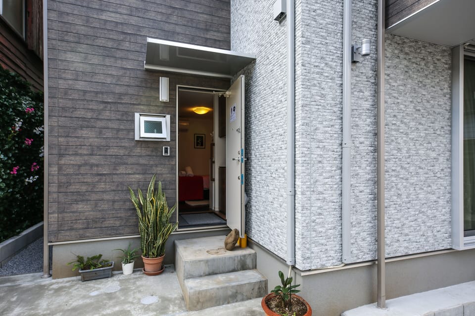 Warm and secure entryway welcomes you home to your private retreat in Tokyo