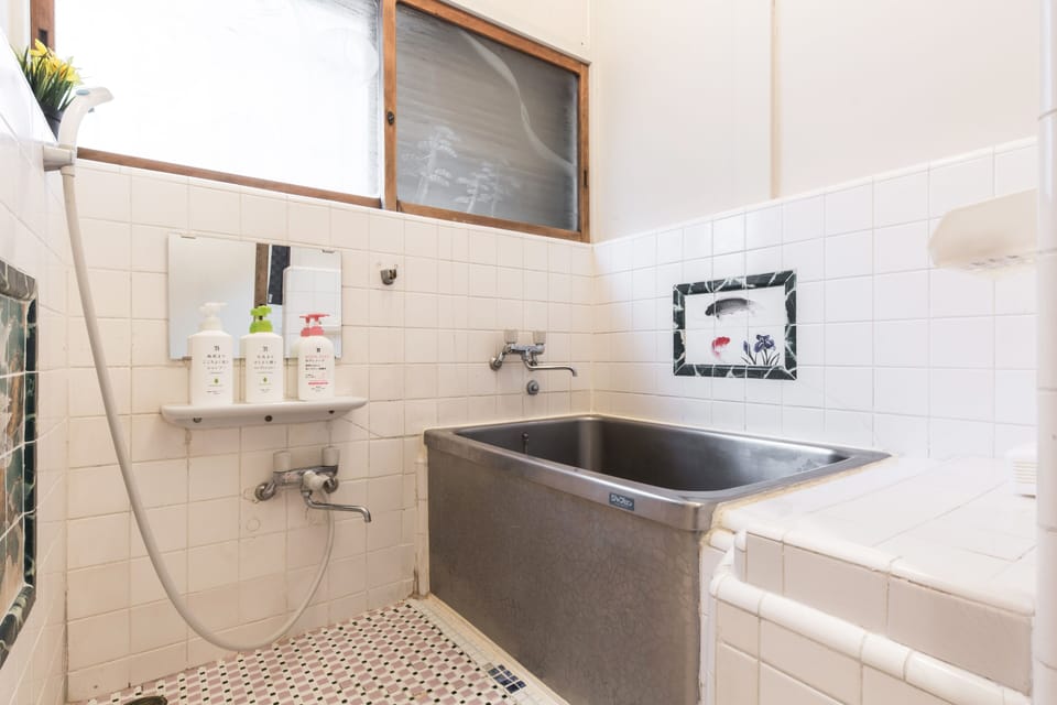 Classic Japanese-style bathroom with traditional soaking tub