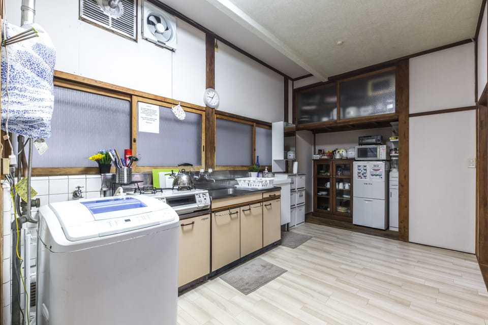 Fully stocked kitchen with modern appliances and dish storage