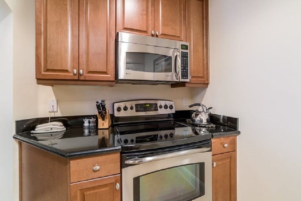 Fully equipped kitchen with granite counters and stainless steel appliances