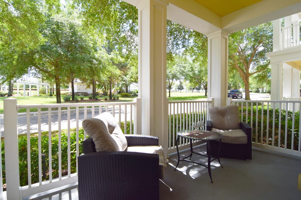 Beautiful balcony with seating and views to the community pool