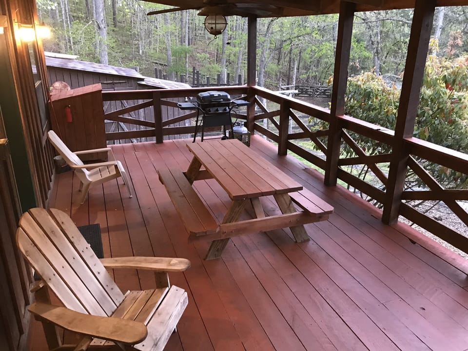 Covered deck with propane grill. 